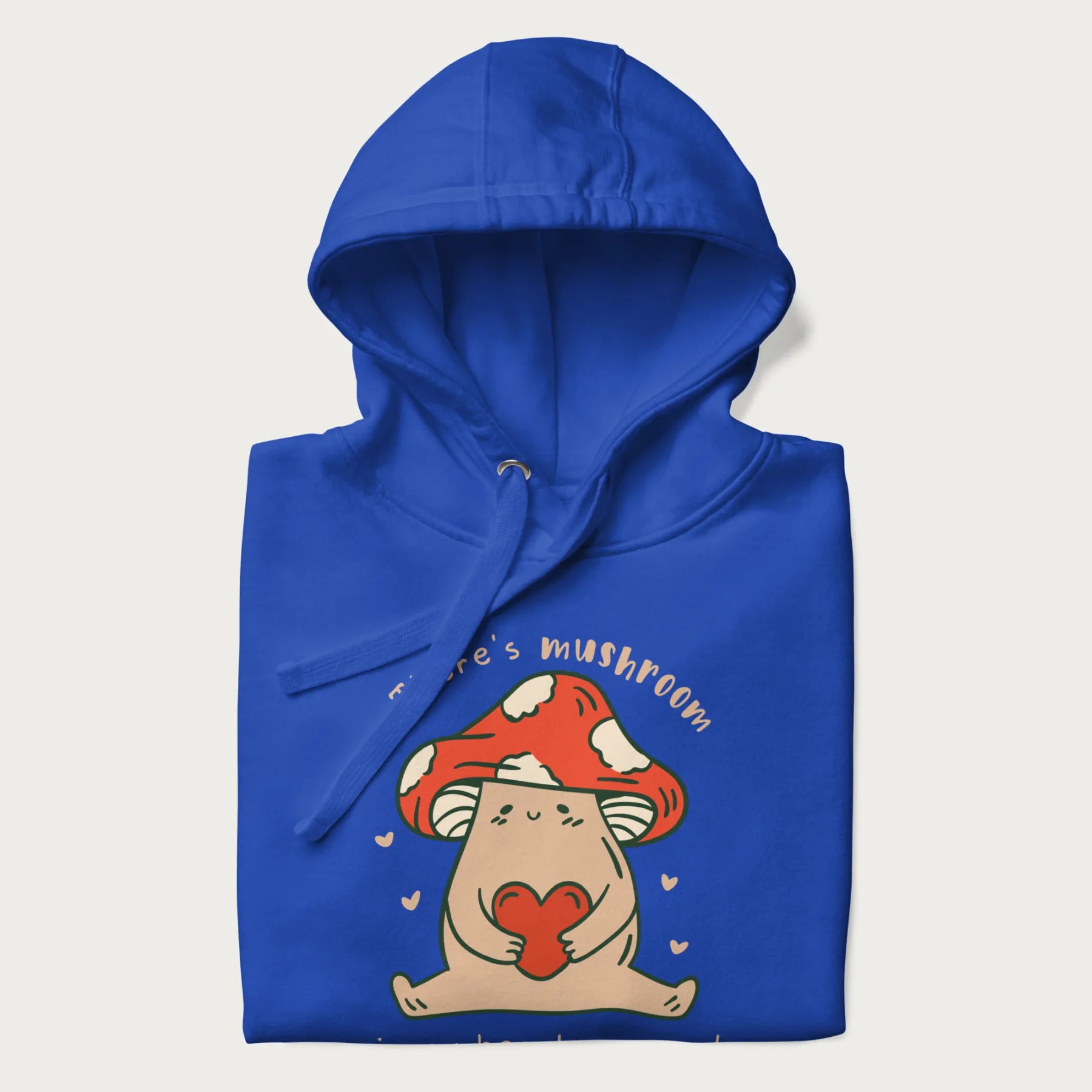 Folded royal blue hoodie with a graphic of a mushroom character holding a heart and the text 'There's Mushroom in My Heart for You'.