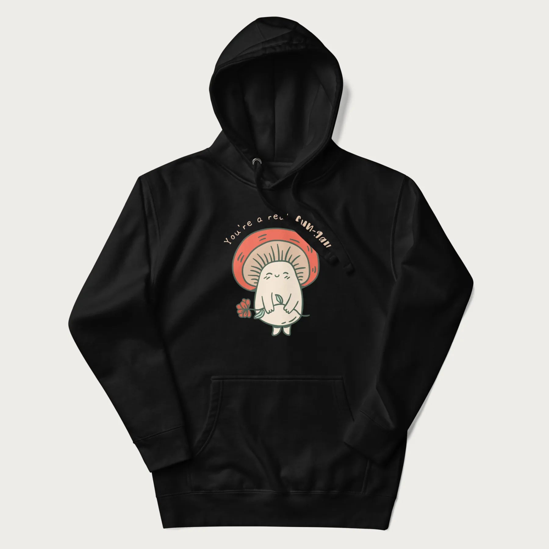 Black hoodie with a graphic of a cute mushroom character holding a flower and the text 'You're a real fun-gal!'.