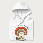 Folded white hoodie with a graphic of a cute mushroom character holding a flower and the text 'You're a real fun-gal!'.