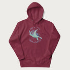 Maroon hoodie with a graphic of a sea turtle with coral on it's shell and the text 'Skip a Straw, Save a Turtle'.