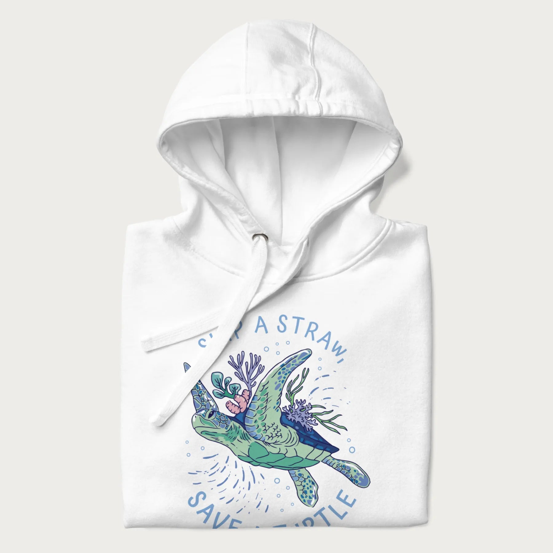 Folded white hoodie with a graphic of a sea turtle with coral on it's shell and the text 'Skip a Straw, Save a Turtle'.