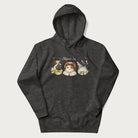 Dark grey hoodie with a graphic of three cats in vintage-inspired attire and the text 'Cottagecore Cats'.