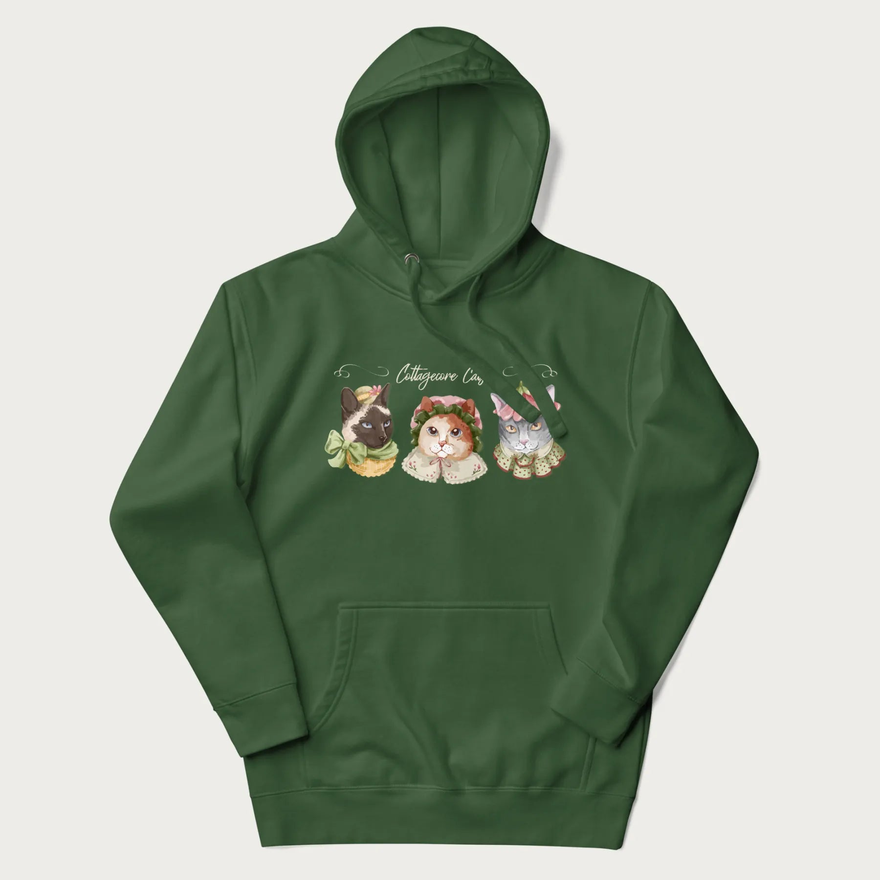 Forest green hoodie with a graphic of three cats in vintage-inspired attire and the text 'Cottagecore Cats'.