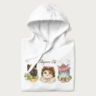 Folded white hoodie with a graphic of three cats in vintage-inspired attire and the text 'Cottagecore Cats'.