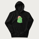 Black hoodie with a graphic of a green frog wearing a mushroom cap surrounded by stars.