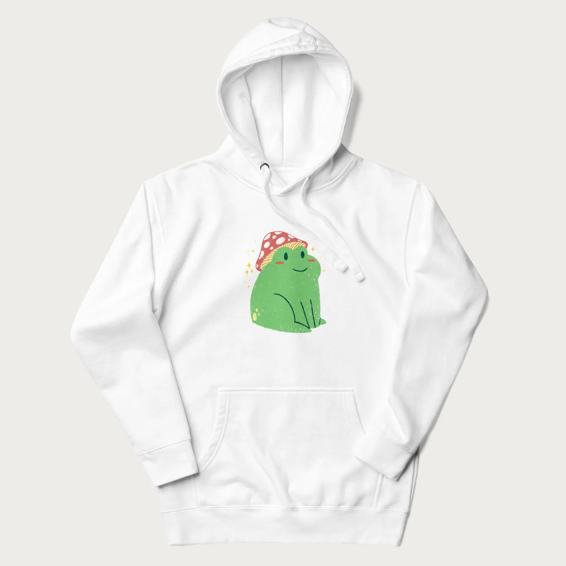 White hoodie with a graphic of a green frog wearing a mushroom cap surrounded by stars.