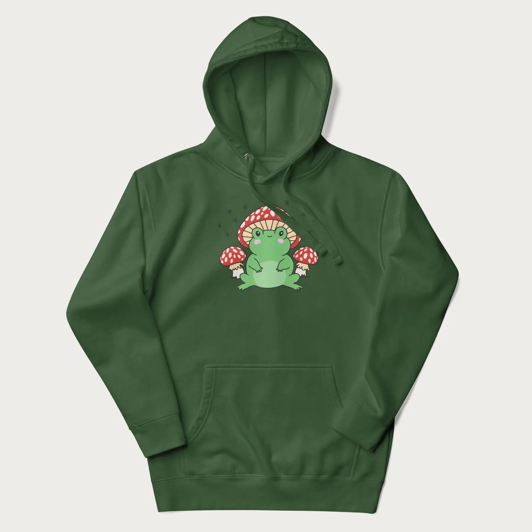 Forest green hoodie will illustration of a cute green frog with red and white mushrooms.