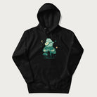 Black hoodie with graphic of a frog playing a banjo on a mushroom with stars and a crescent moon.