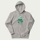 Light grey hoodie with graphic of a frog playing a banjo on a mushroom with stars and a crescent moon.