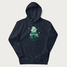 Navy blue hoodie with graphic of a frog playing a banjo on a mushroom with stars and a crescent moon.