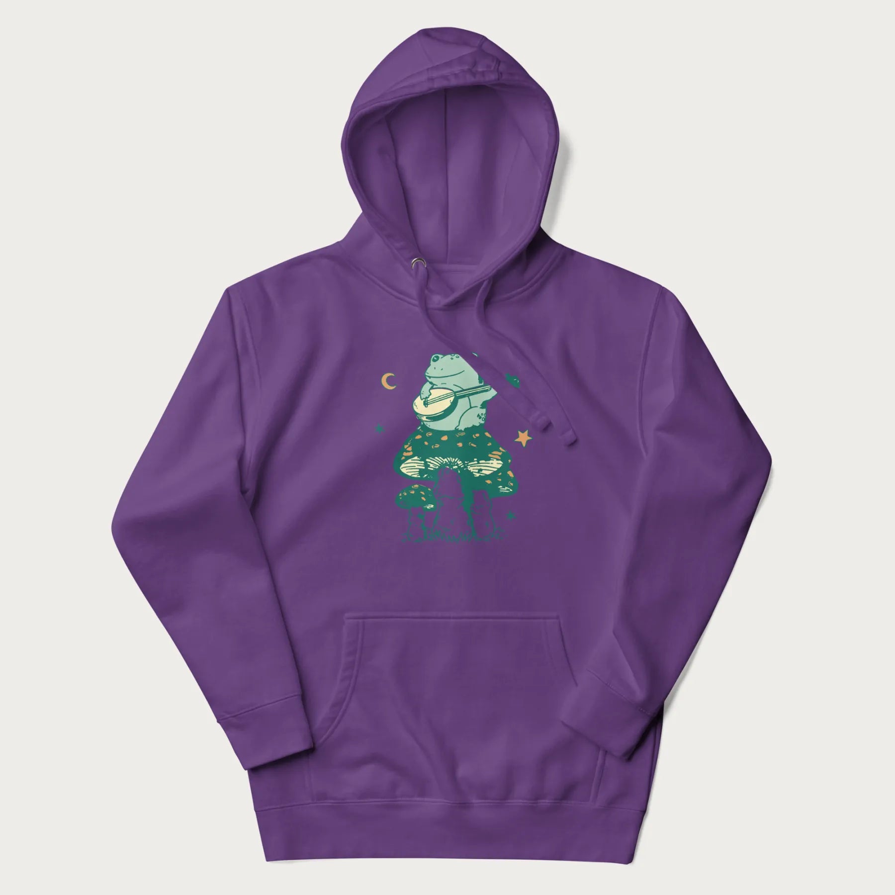 Purple hoodie with graphic of a frog playing a banjo on a mushroom with stars and a crescent moon.