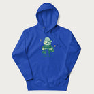 Royal blue hoodie with graphic of a frog playing a banjo on a mushroom with stars and a crescent moon.