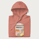 Cartoon cats in a pill bottle labeled 'Happy Pills' on a folded light pink hoodie.