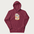Cartoon cats in a pill bottle labeled 'Happy Pills' on a maroon hoodie.