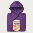 Cartoon cats in a pill bottle labeled 'Happy Pills' on a folded purple hoodie.