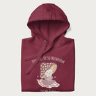 Folded maroon hoodie with a cute mushroom character and the text 'You Take Up So Mushroom in My Heart'.