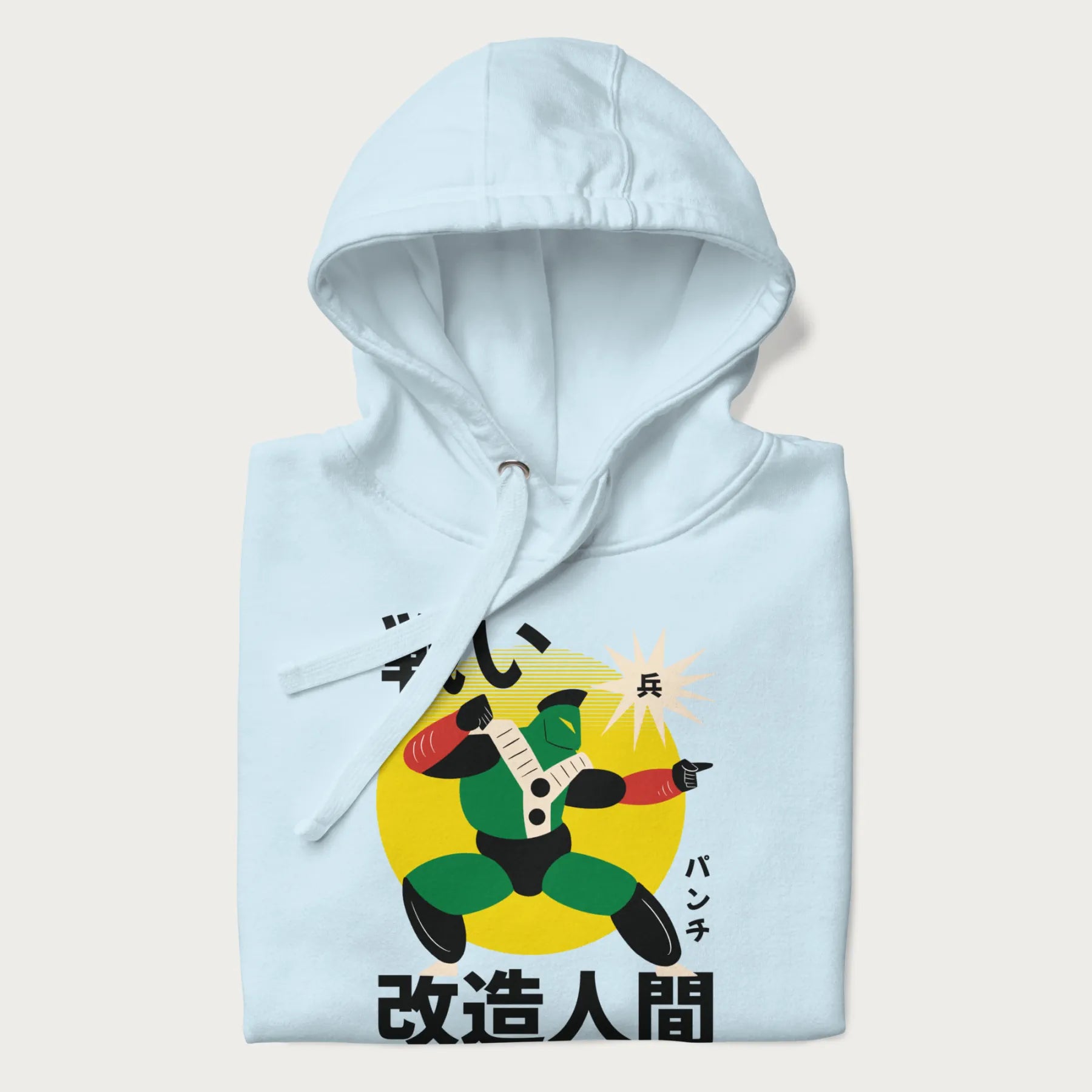 Folded light blue hoodie with Japanese text and retro graphic of a cyborg.