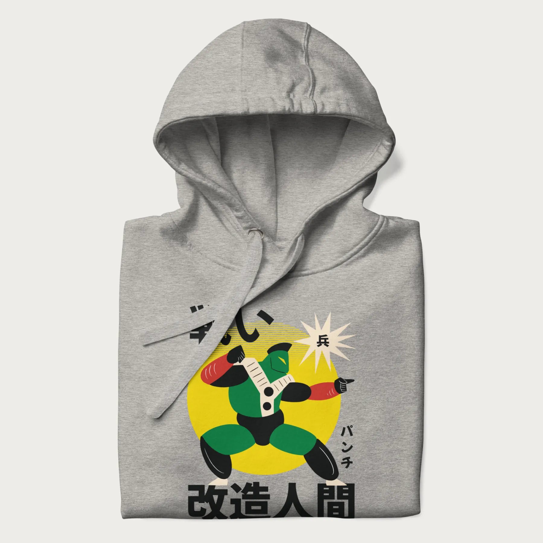 Folded light grey hoodie with Japanese text and retro graphic of a cyborg.