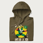 Folded military green hoodie with Japanese text and retro graphic of a cyborg.