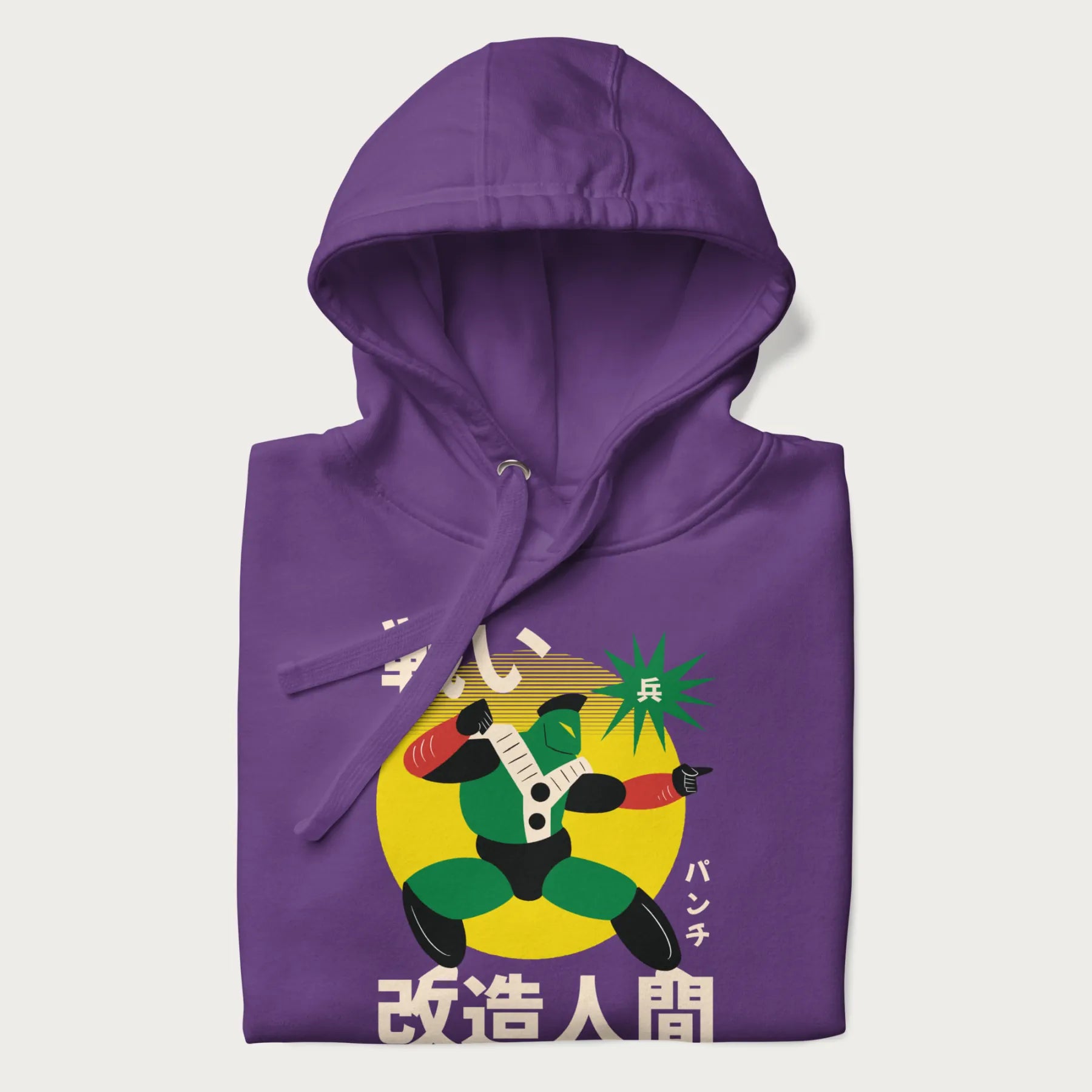 Folded purple hoodie with Japanese text and retro graphic of a cyborg.