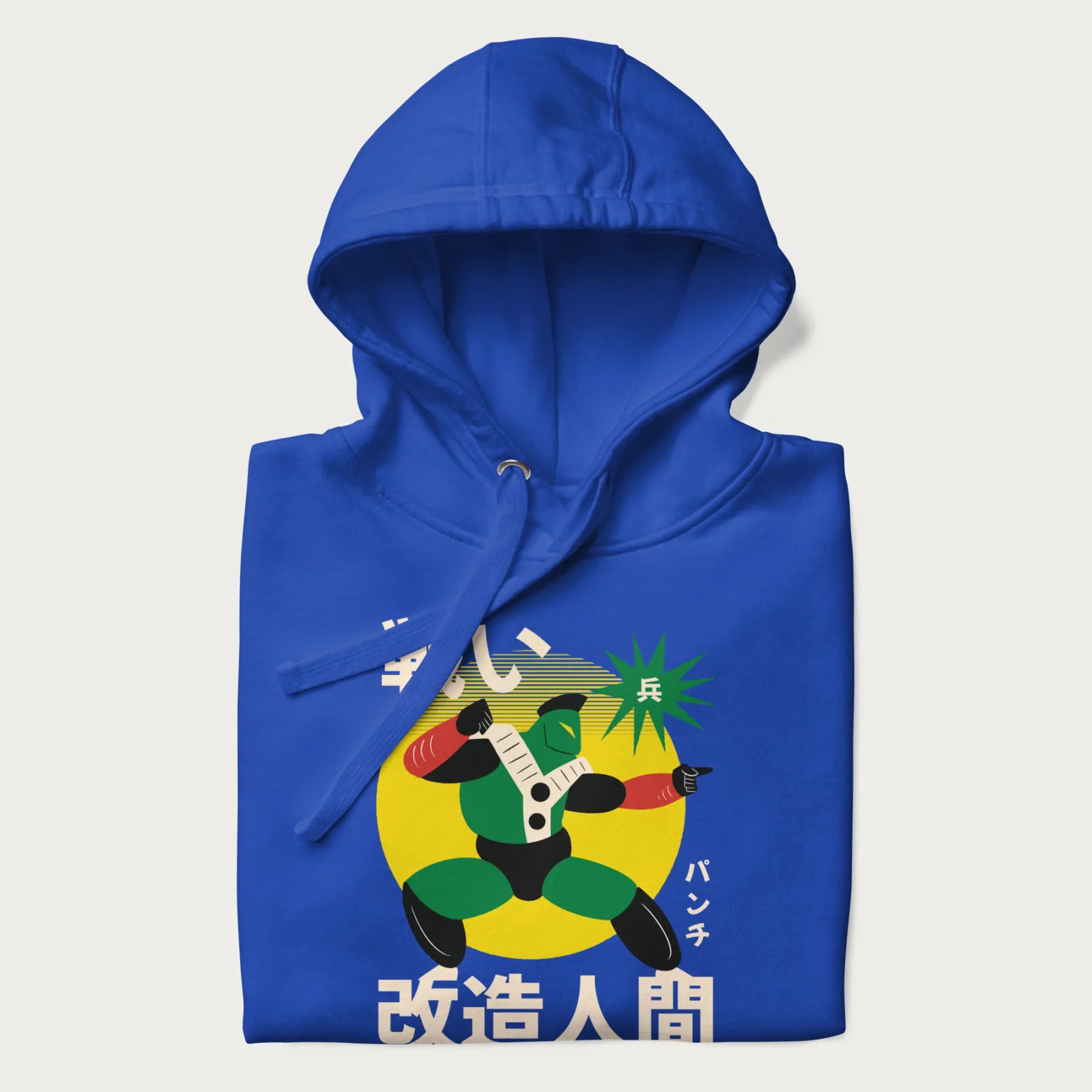 Folded royal blue hoodie with Japanese text and retro graphic of a cyborg.