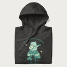 Folded dark grey hoodie with a graphic of a frog playing a banjo on a mushroom under the moon and stars, with the text 'Don't Worry, Everything's Gonna Be Just Fine.'