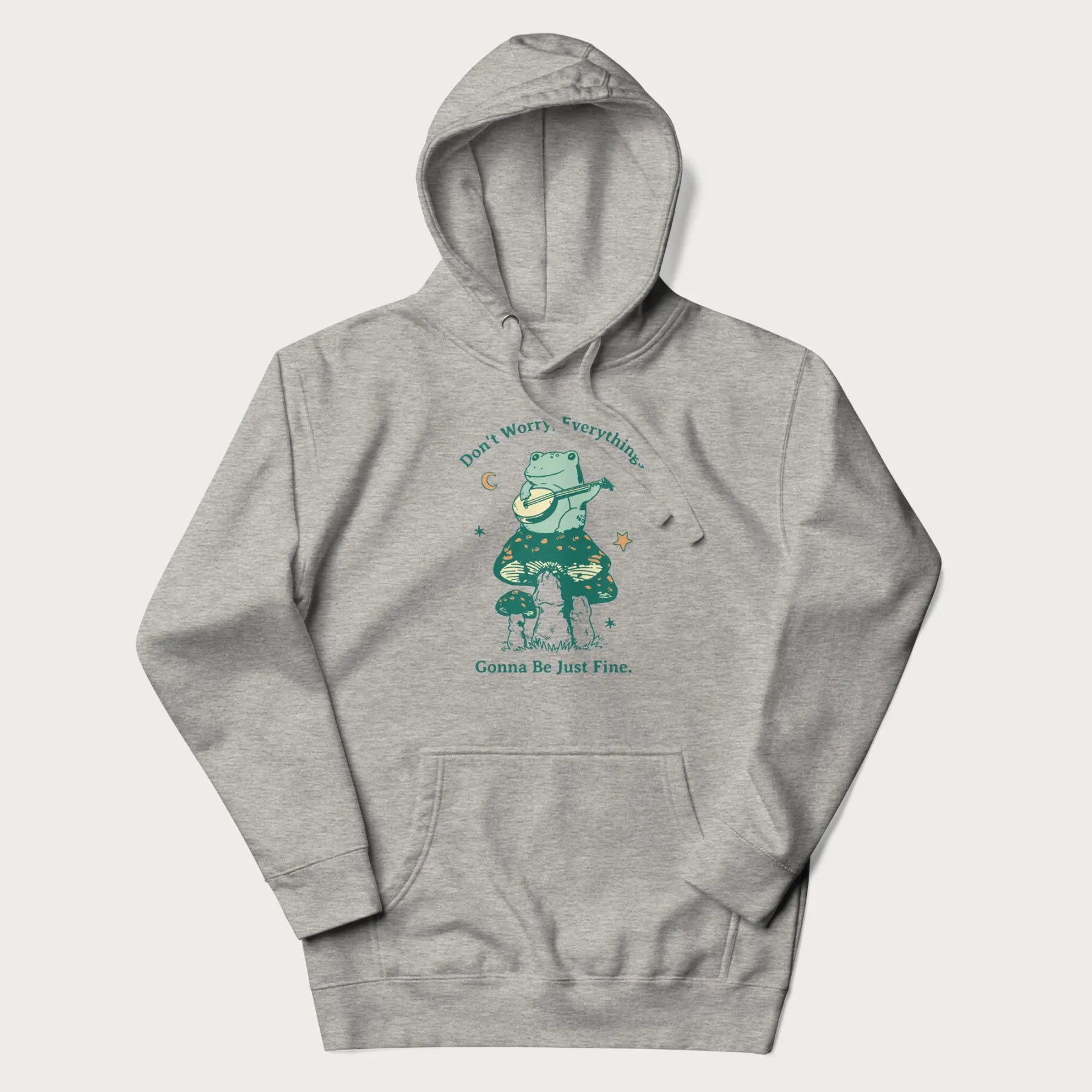 Light grey hoodie with a graphic of a frog playing a banjo on a mushroom under the moon and stars, with the text 'Don't Worry, Everything's Gonna Be Just Fine.'