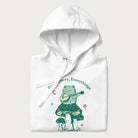 Folded white hoodie with a graphic of a frog playing a banjo on a mushroom under the moon and stars, with the text 'Don't Worry, Everything's Gonna Be Just Fine.'