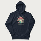 Navy blue hoodie with a graphic of a frog knitting under a large mushroom with the text 'Don't Worry, Everything's Gonna Be Just Fine'.