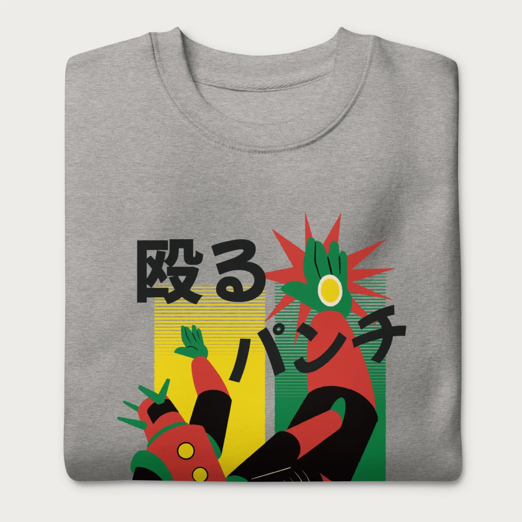 Folded light grey sweatshirt with Japanese text and a retro mecha punch graphic.