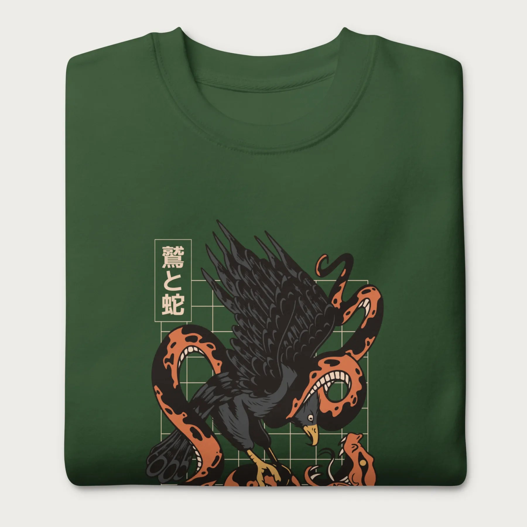 Folded forest green sweatshirt with Japanese text and a graphic of an eagle and a snake in combat.