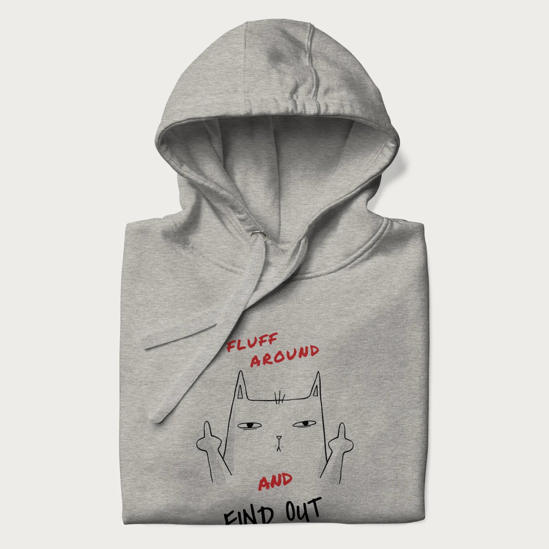 Folded light grey hoodie with a graphic of a cat raising its middle fingers and the text "FLUFF AROUND AND FIND OUT" in red.