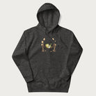 Dark grey hoodie with a graphic of a frog lounging in a hammock between tall mushrooms.