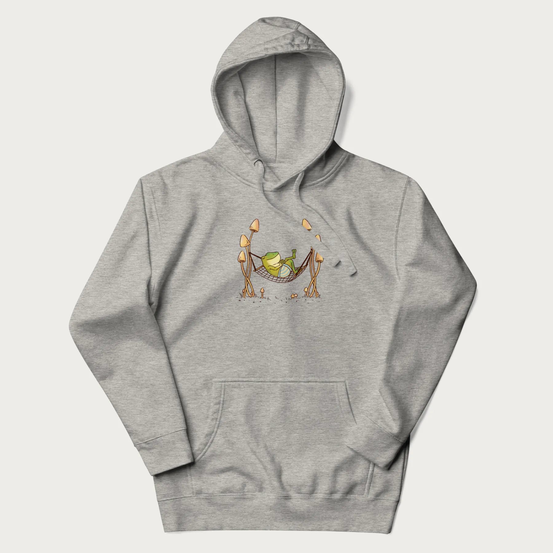 Light grey hoodie with a graphic of a frog lounging in a hammock between tall mushrooms.