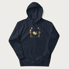 Navy blue hoodie with a graphic of a frog lounging in a hammock between tall mushrooms.