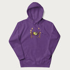 Purple hoodie with a graphic of a frog lounging in a hammock between tall mushrooms.
