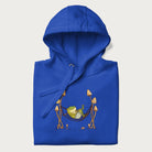Folded royal blue hoodie with a graphic of a frog lounging in a hammock between tall mushrooms.