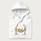 Folded white hoodie with a graphic of a frog lounging in a hammock between tall mushrooms.
