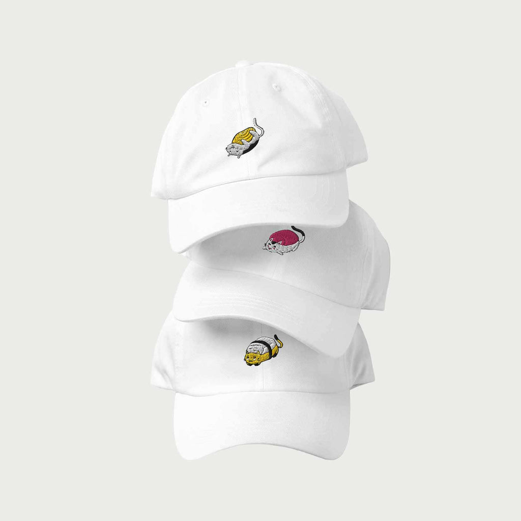 Three neatly stacked hats with embroidered sushi cats.
