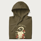 Folded military green hoodie with a graphic of a cat nestled among flowers and mushrooms with the text 'Home is Where My Cat Is' above.