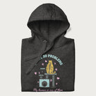 Folded dark grey hoodie with graphic of a cat on a scratching post and text 'i have 99 problems, my human is one of them'.