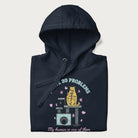 Folded navy blue hoodie with graphic of a cat on a scratching post and text 'i have 99 problems, my human is one of them'.