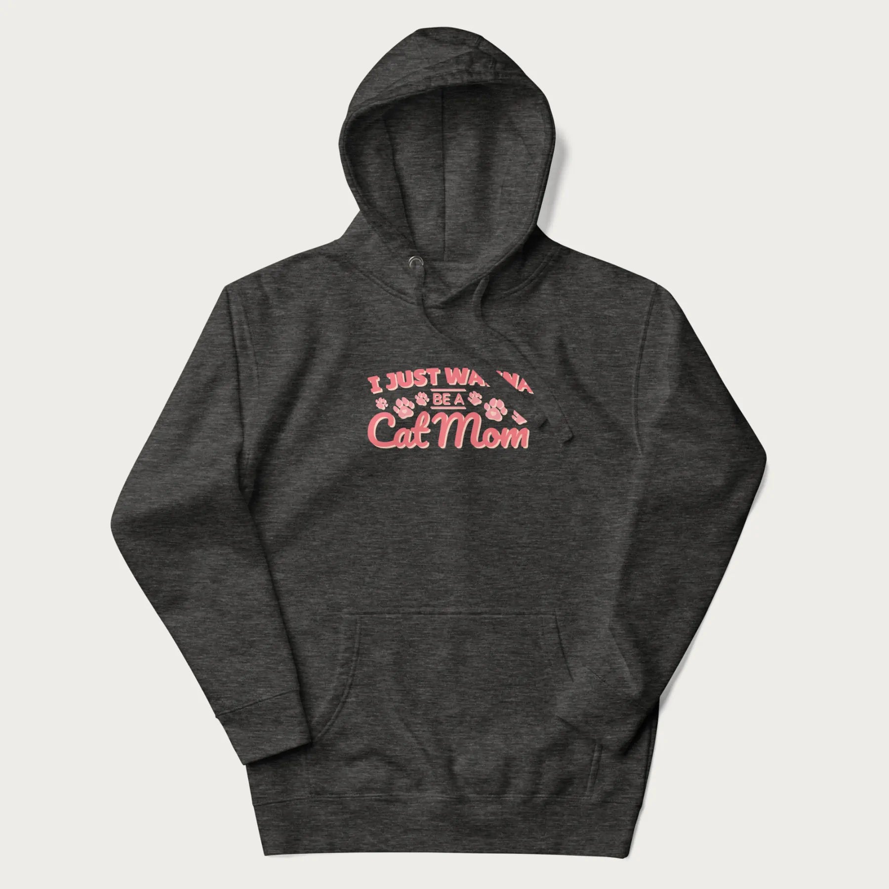 Graphic on a dark grey hoodie saying 'I Just Wanna Be a Cat Mom' with pink lettering and paw prints.