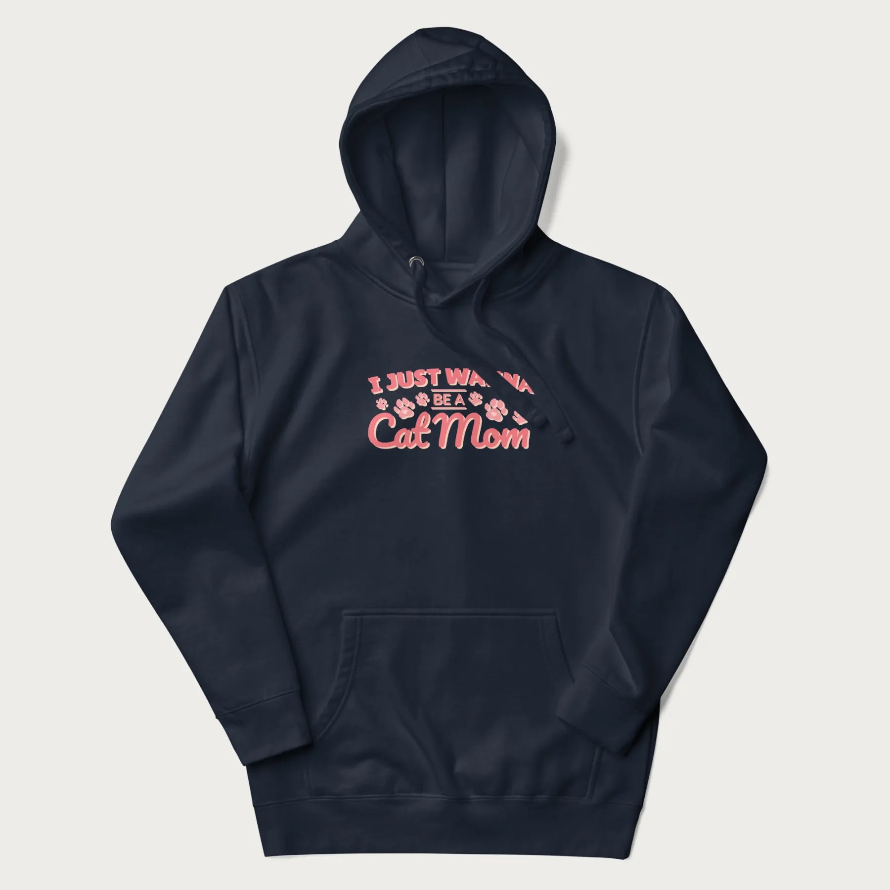 Graphic on a navy blue hoodie saying 'I Just Wanna Be a Cat Mom' with pink lettering and paw prints.