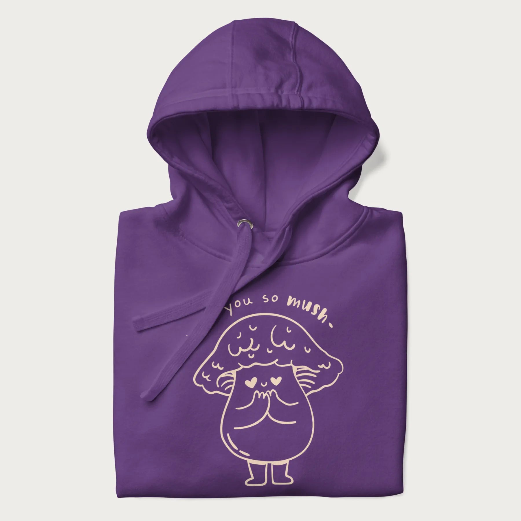 Folded purple hoodie with graphic of a cute mushroom with heart-shaped eyes and the text "I Love You So Mush."