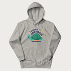 Light grey hoodie with a graphic of a happy turtle on a skateboard and the text 'I Wanna Go Faaaaast'.