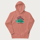 Light pink hoodie with a graphic of a happy turtle on a skateboard and the text 'I Wanna Go Faaaaast'.