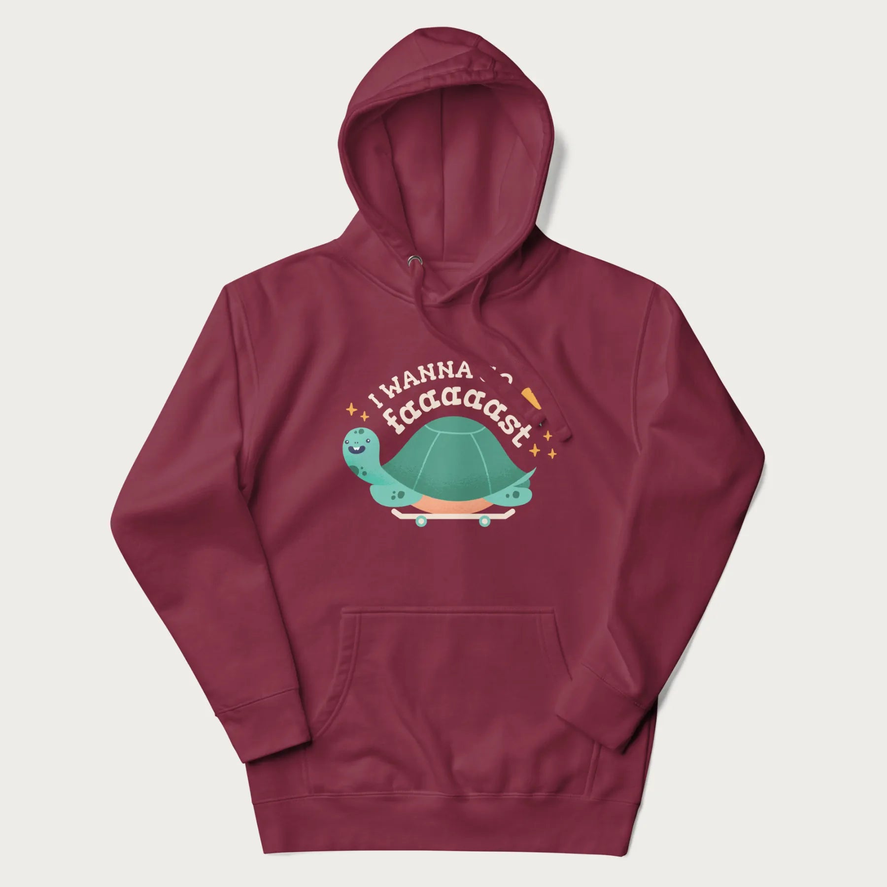 Maroon hoodie with a graphic of a happy turtle on a skateboard and the text 'I Wanna Go Faaaaast'.