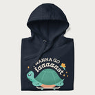 Folded navy blue hoodie with a graphic of a happy turtle on a skateboard and the text 'I Wanna Go Faaaaast'.