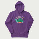 Purple hoodie with a graphic of a happy turtle on a skateboard and the text 'I Wanna Go Faaaaast'.